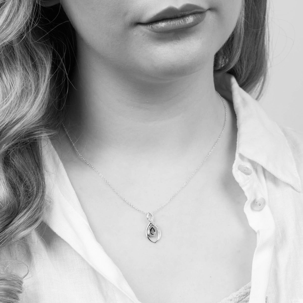 Elements Gold Twist Teardrop Blue Topaz Pendant with Diamond